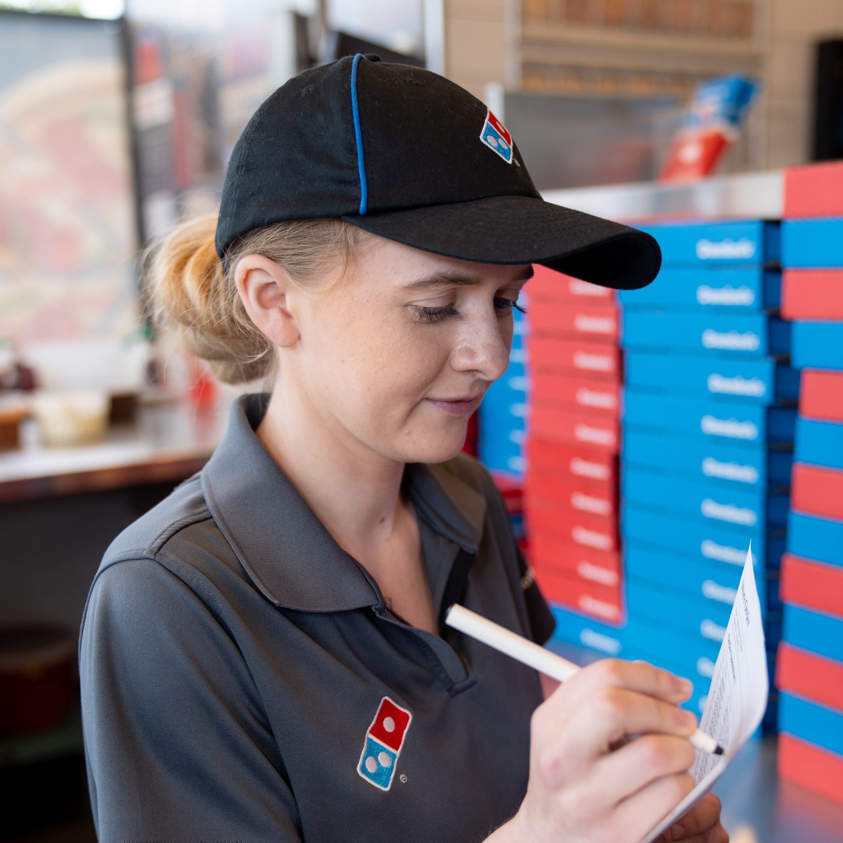 Domino's colleague checking stock